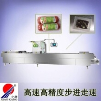 山東小康牌520型全自動連續(xù)拉伸膜真空包裝機/魚豆腐豆干真空包裝機